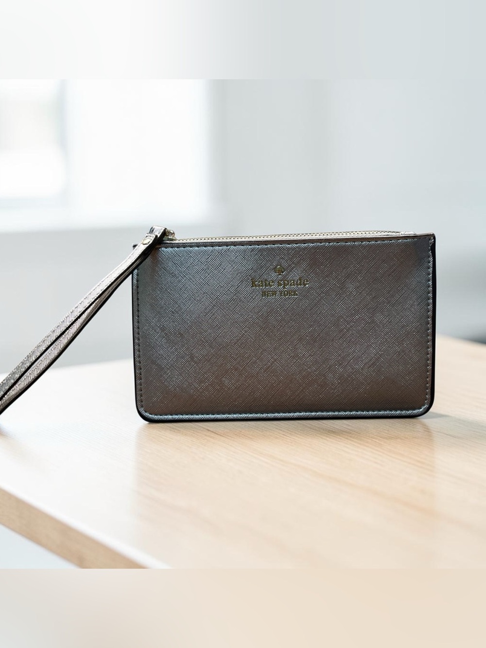 Kate Spade, New York metallic silver wristlet